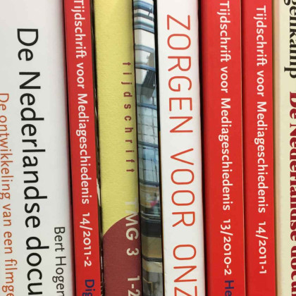 Side view of book covers in different colours